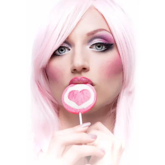 A pink-haired woman with a heart-shaped lollipop